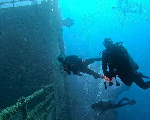 Scuba diver practicing neutral buoyancy and trim underwater