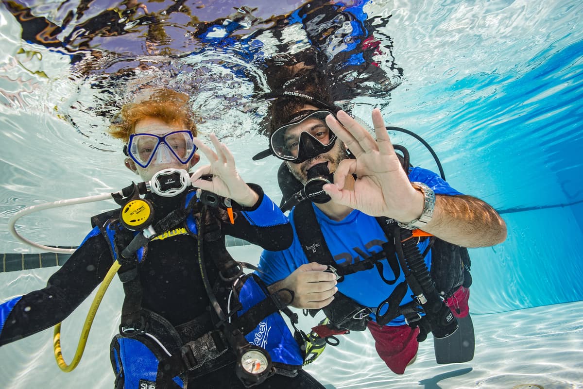 Beginner divers being trained on the reef