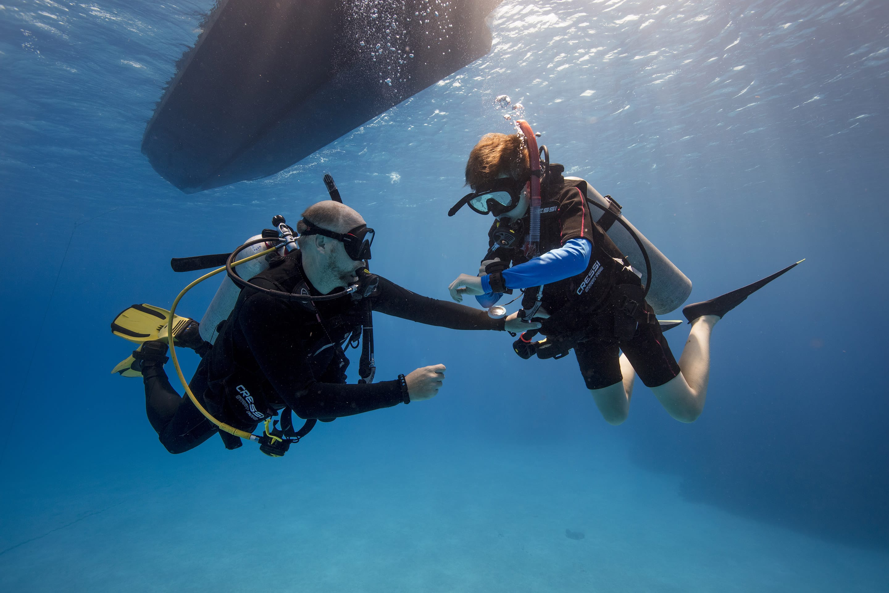 Open Water students completing supervised certification dives in clear Key Largo water